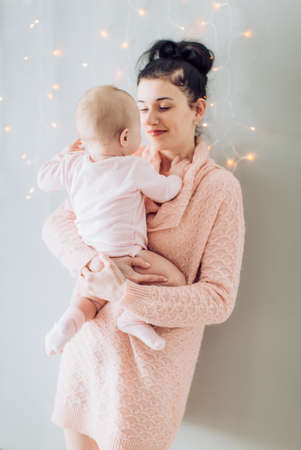 Portrait of beautiful young woman with a small daughterの写真素材