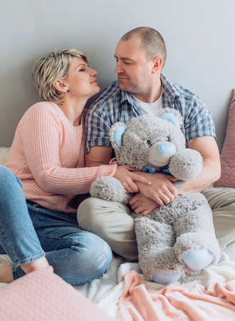 Beautiful blonde woman with her husbandの写真素材