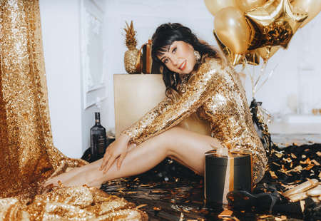 Happy Glamour Woman on a gold party. party people