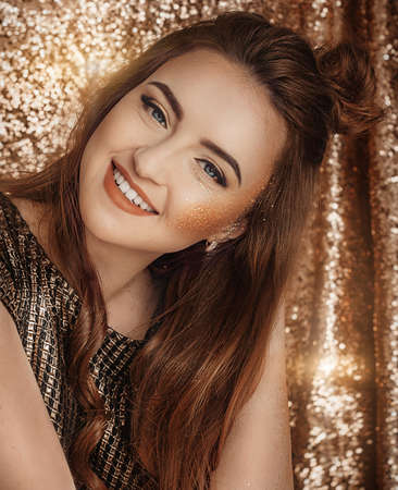 Happy Glamour Woman on a gold party. party peopleの写真素材