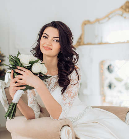 Beautiful bride with stylish make-up in white dressの写真素材