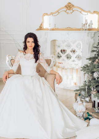 Beautiful bride with stylish make-up in white dressの写真素材
