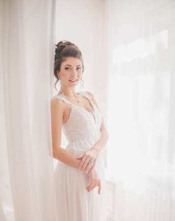 Beautiful bride in white dress on her wedding dayの写真素材