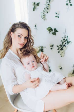 Portrait of a beautiful young woman with little daughterの写真素材