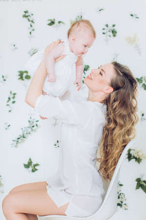 Portrait of a beautiful young woman with little daughterの写真素材