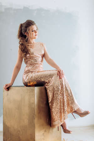 Portrait of beautiful woman with makeup in fashion clothesの写真素材