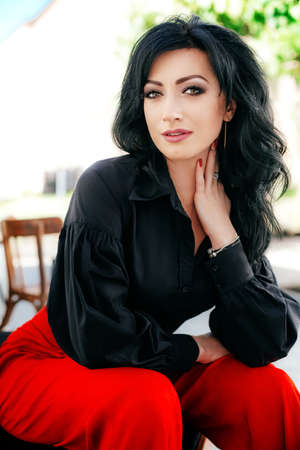 Portrait of beautiful woman with makeup in fashion clothesの写真素材