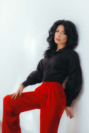 Portrait of beautiful woman with makeup in fashion clothesの写真素材