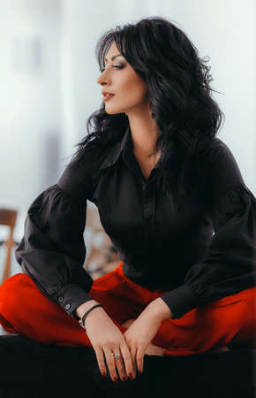 Portrait of beautiful woman with makeup in fashion clothesの写真素材