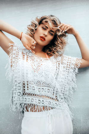 Portrait of beautiful woman with makeup in fashion clothesの写真素材