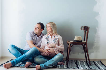 Beautiful pregnant woman with her husband