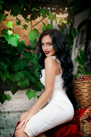 Portrait of beautiful woman with makeup in fashion clothesの写真素材