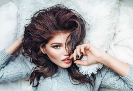 Portrait of beautiful young woman with makeup in fashion clothesの写真素材
