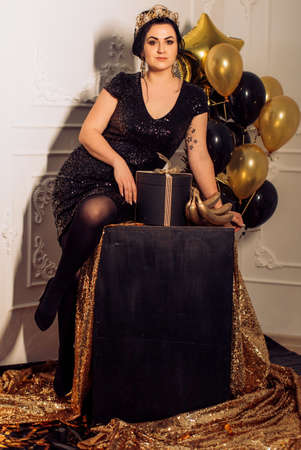 Happy Glamour Woman on a gold party. party peopleの写真素材