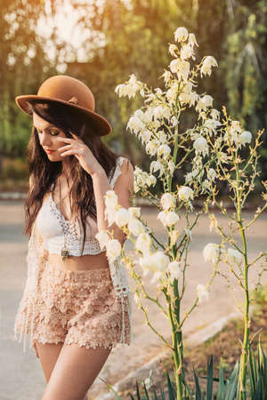 Beautiful young woman in spring gardenの写真素材