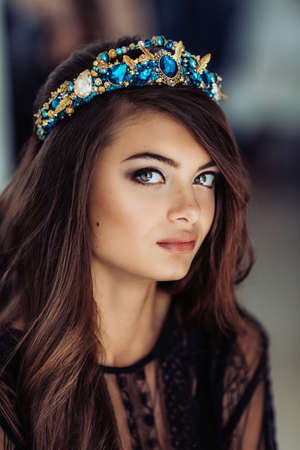 Beautiful woman model with professional makeup, in jewelry. crownの写真素材