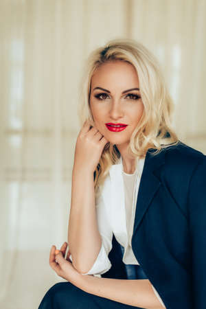 Beautiful fashion model Woman with blonde hair, Red lipstick .の写真素材