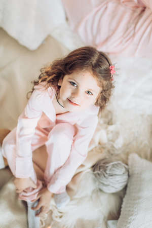 Beautiful little girl in pink dressの写真素材