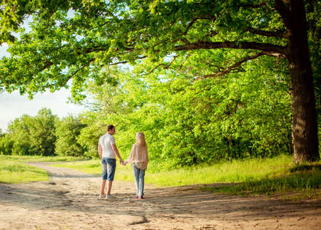 Young couple in love on park lawnの写真素材