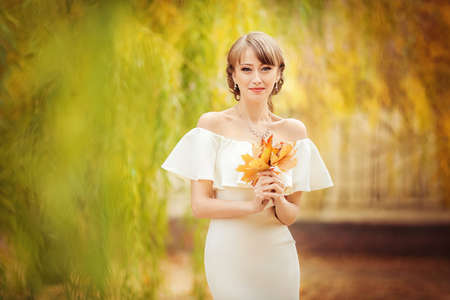 Beautiful bride in white dress in the gardenの写真素材