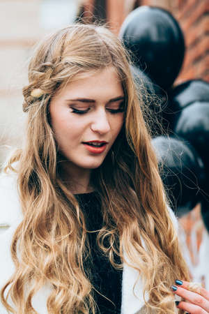 Beautiful girl in autumn gardenの写真素材