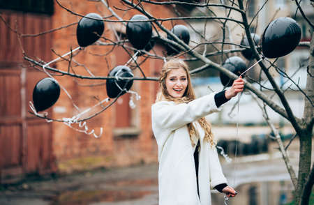Beautiful girl in autumn gardenの写真素材