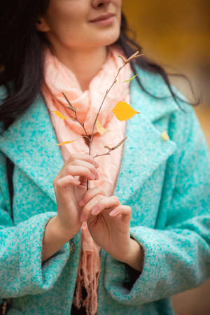 Beautiful girl in autumn gardenの写真素材