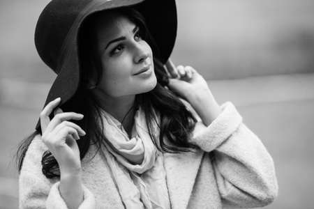 Portrait of beautiful young woman with makeup in hatの写真素材