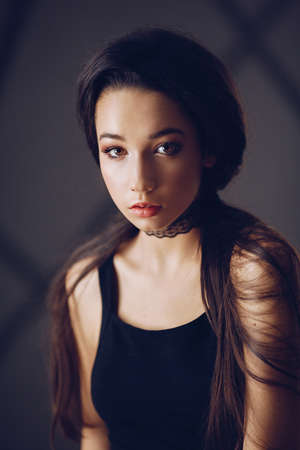 Portrait of beautiful brunette girl with makeupの写真素材