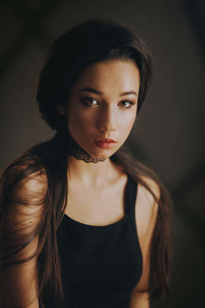 Portrait of beautiful brunette girl with makeupの写真素材