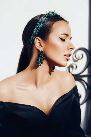 Portrait of beautiful young brunette woman with makeupの写真素材