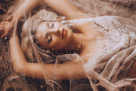 Portrait of beautiful young blonde woman with makeup