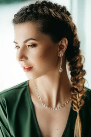 Portrait of beautiful young brunette woman with makeupの写真素材