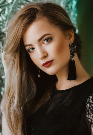 Portrait of beautiful young blonde woman with makeupの写真素材