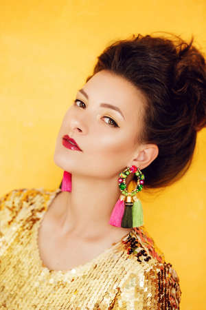 Portrait of beautiful young brunette woman with makeupの写真素材