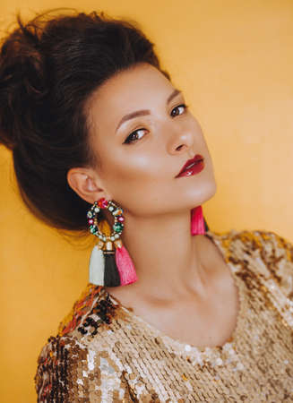 Portrait of beautiful young brunette woman with makeupの写真素材