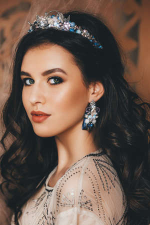 Portrait of beautiful young brunette woman with makeupの写真素材