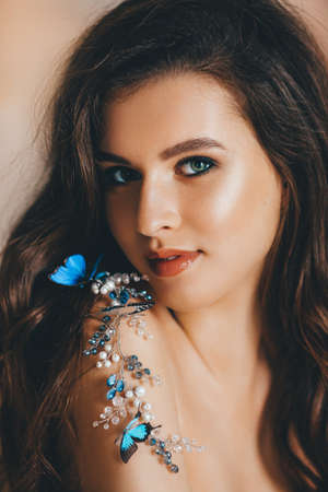 Portrait of beautiful young brunette woman with makeupの写真素材