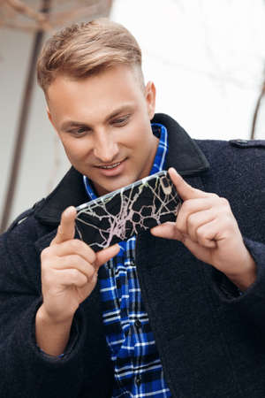 Young beautiful man with a mobile telephone