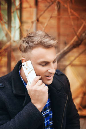 Young beautiful man with a mobile telephone