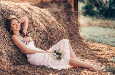 Beautiful young woman in spring gardenの写真素材