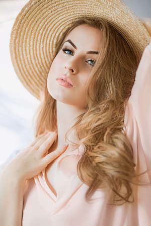 Portrait of fashionable girl with a hatの写真素材