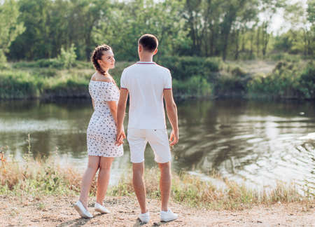 Young couple in love on park lawnの写真素材