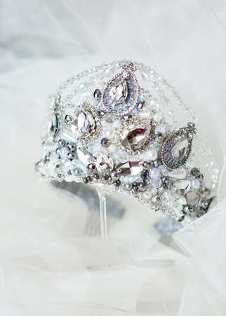 Beautiful silver crown on a gray background for the designの写真素材