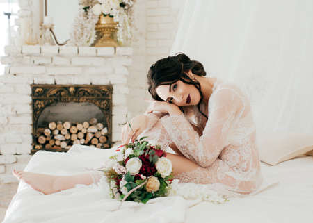 Portrait of beautiful young brunette is in underclothes.Morning of fianceeの写真素材