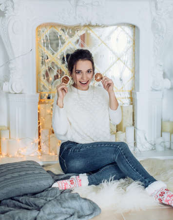 Happy brunette women in Christmas decorations