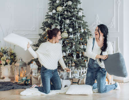 Portrait of two beautiful young girls is in Christmas sceneriesの写真素材