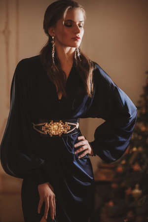 Beautiful young girl in blue dressの写真素材