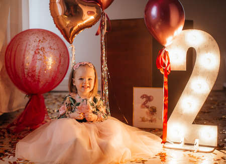 Beautiful little girl celebrating birthday party.