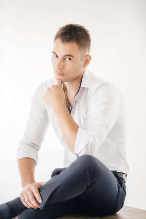 Portrait beautiful young man in whiteの写真素材